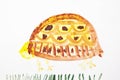 Big yellow turtle. Real drawing of a small child. Drawing by watercolor. Royalty Free Stock Photo