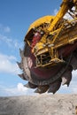 Big yellow wheel of coal excavator Royalty Free Stock Photo