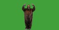 Bigfoot or Sasquatch looking and gesturing up on green screen