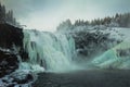 Biggest frozen swedish waterfall Tannforsen in winter time Royalty Free Stock Photo
