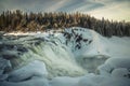 Biggest frozen swedish waterfall Tannforsen in winter time Royalty Free Stock Photo