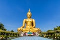 Biggest golden buddha statue on blue sky background