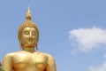 Biggest golden Buddha statue in the world against blue sky and white clouds background, Thailand Royalty Free Stock Photo