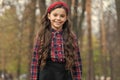 Biggest Hair Accessory Trends. Adorable little girl checkered shirt wear red headband. Fashion trend. Accessories. Fancy