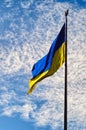 The Biggest National flag Ukraine against blue sky with fantastic soft clouds. Blue and yellow flag of Ukraine Royalty Free Stock Photo