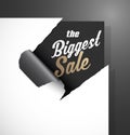 The Biggest Sale text uncovered from teared paper corner. Royalty Free Stock Photo