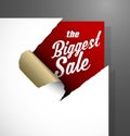 The Biggest Sale text uncovered from teared paper corner.