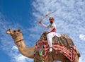 Indian Rajasthani man in traditional clothes poses for a photo during Bikaner Camel Festival in Rajasthan