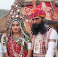 Indian Rajasthani people in national clothes poses for a photo during Camel Festival in Rajasthan, India