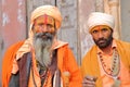 BIKANER, RAJASTHAN, INDIA - DECEMBER 23, 2017: Portrait of two Sadhus holy men with a long beard and colorfully dressed