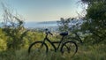 Bike adventure above the city, blue sky seascape and cape top view Royalty Free Stock Photo