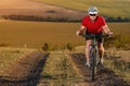 Bike adventure travel photo. Cyclist on the Beautiful Meadow Trail on sunny day. Royalty Free Stock Photo