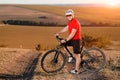 Bike adventure travel photo. Cyclist on the Beautiful Meadow Trail on sunny day. Royalty Free Stock Photo