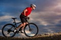 Bike adventure travel photo. Bike tourists ride on the countryside downhill. Royalty Free Stock Photo