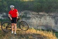 Bike adventure travel photo. Cyclist on the Beautiful Meadow Trail on sunny day. Royalty Free Stock Photo