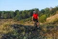 Bike adventure travel photo. Cyclist on the Beautiful Meadow Trail on sunny day. Royalty Free Stock Photo