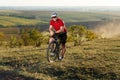 Bike adventure travel photo. Cyclist on the Beautiful Meadow Trail on sunny day. Royalty Free Stock Photo