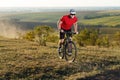 Bike adventure travel photo. Cyclist on the Beautiful Meadow Trail on sunny day. Royalty Free Stock Photo