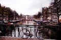 Bike Against a Bridge by Nightfall, Amsterdam Royalty Free Stock Photo