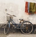 Bike against wall at sunset