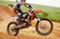 Bike, balance and motion blur with a sports man on space outdoor for dirt biking closeup. Motorcycle, fitness and