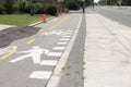 bike bicycle pedestrian path next to road street with stencil outline. ph Royalty Free Stock Photo