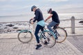 Bike, cycling and fitness with a senior couple on the promenade, riding eco friendly transport for travel. Bicycle Royalty Free Stock Photo