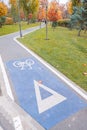 Bike cycling traffic sings on a track from the middle of a park