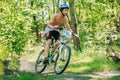 Bike cyclist riding track in forest at sunny day, healthy lifest Royalty Free Stock Photo