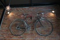 Bike decorated on a brick wall,classic style.