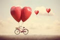 A bike decorated with two heart-shaped balloons, spreading love and joy through every ride, Bicycle built for two with a heart- Royalty Free Stock Photo