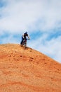 Bike Downhill on red hill Royalty Free Stock Photo
