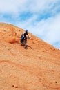 Bike Downhill on red hill Royalty Free Stock Photo