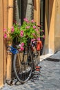 Bike with flowers on the street in Rome Royalty Free Stock Photo