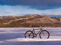 Bike on frozen Lake Laberge, Yukon, Canada Royalty Free Stock Photo