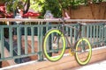 Bike with Green Rims on Banister