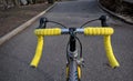 bike handlebar detail with bright yellow bar tape (bicycle cockpit, cycling) shifters, brifters, black quill stem Royalty Free Stock Photo