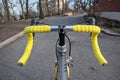 bike handlebar detail with bright yellow bar tape (bicycle cockpit, cycling) shifters, brifters, black quill stem Royalty Free Stock Photo