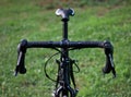 bike handlebars detail (front of bicycle with shifters, saddle, seatpost, cables and bar tape visible) outdoor cycling Royalty Free Stock Photo