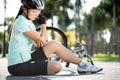 Bike injuries. Woman cyclist fell off road bike while cycling. Bicycle accident, injured elbow