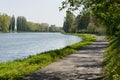 Bike lane bicycle cycle path by the river green trees EU supported project Royalty Free Stock Photo