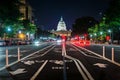 Bike lanes on Pennsylvania Avenue and the United States Capitol at night, in Washington, DC