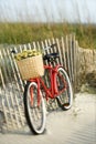 Bike leaning against fence at beach. Royalty Free Stock Photo