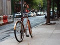 Bike Locked and Parked Leaning on Pole