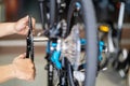 Bike mechanic repairs folding bicycle in Workshop. install Crankset Chainring,  Bicycle Maintenance and Repair concept Royalty Free Stock Photo