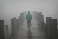 Bike on a misty bridge one morning at Amarapura Royalty Free Stock Photo