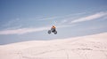 Bike, mockup and jump with a man in the desert riding a vehicle for adventure or adrenaline. Motorcycle, speed and