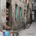 Bike parked on empty dirty alley between old stone buildings on Zanzibar Island Royalty Free Stock Photo