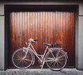 Bike parked in front of a garage door