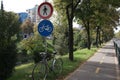 Bike parked under the bicycle sign in Lana river, Tirana, Albania Royalty Free Stock Photo